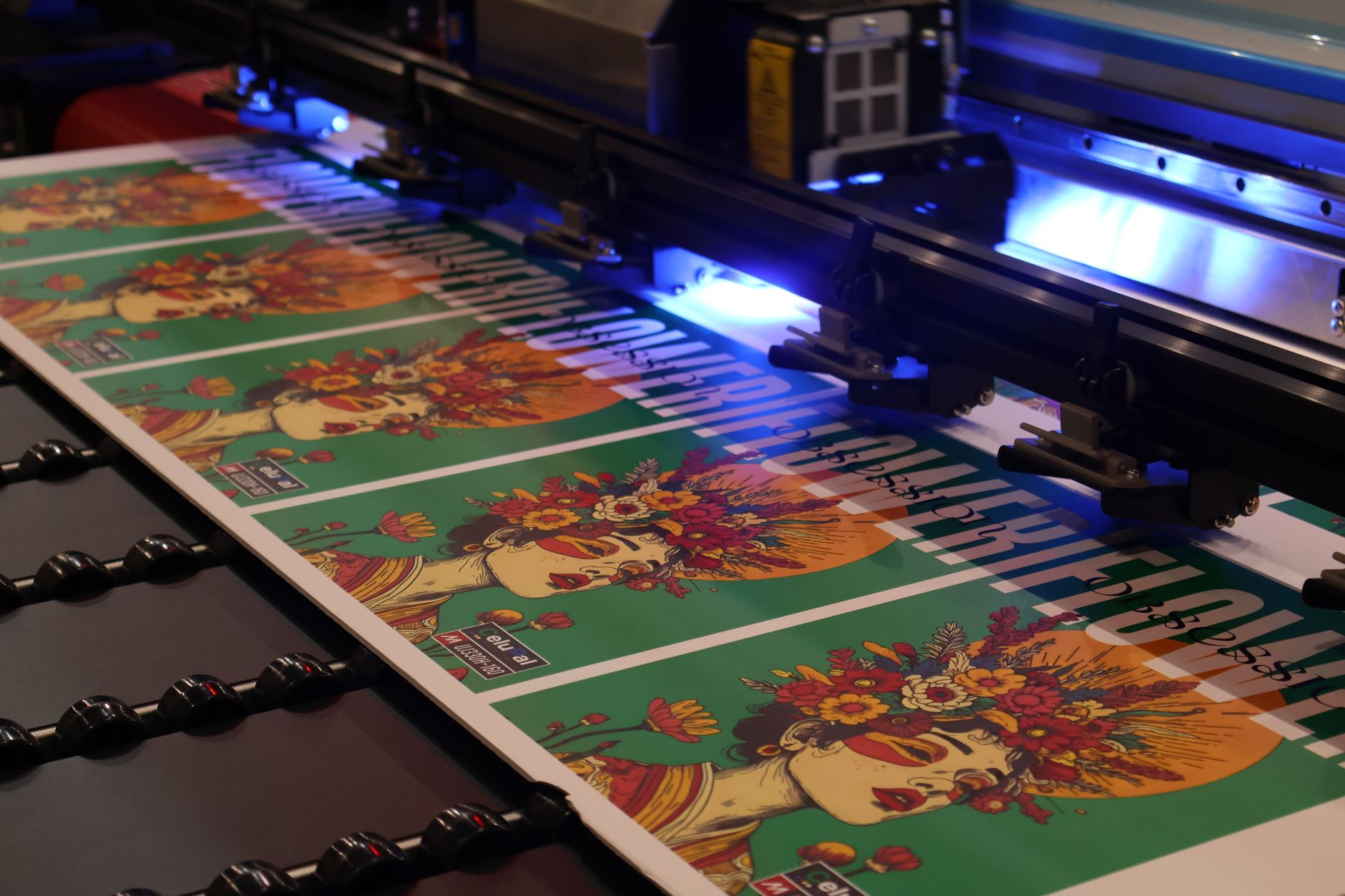 Vivid large-format print coming off a wide-format printer